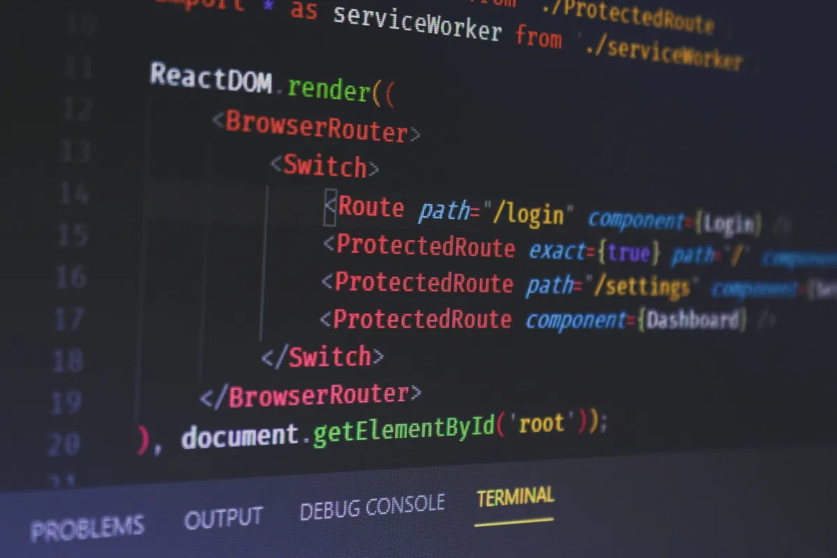 A code editor showing React Router code, with the terminal tab open below